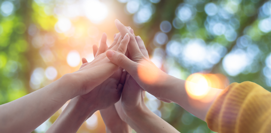 hands touching toward the sky